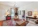 Cozy living room featuring a decorative rug, wooden chest, and large window at 807 9Th St, Golden, CO 80401