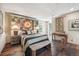 Striking bedroom with a sunburst headboard, wooden floors, and an eclectic mix of decor at 807 9Th St, Golden, CO 80401