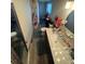 Bathroom featuring a marble countertop sink, and a decorative mirror at 1489 Arapahoe St, Strasburg, CO 80136