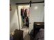 This bedroom closet features a sliding barn door, wood floors and ample storage space at 1489 Arapahoe St, Strasburg, CO 80136