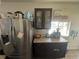 This kitchen features stainless steel appliances, storage, and hardwood flooring at 1489 Arapahoe St, Strasburg, CO 80136