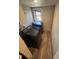 A compact laundry room features a modern washer and dryer set and a small window for natural light at 1489 Arapahoe St, Strasburg, CO 80136
