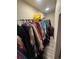 Walk-in closet with wood-style floors and lots of hanging storage at 1489 Arapahoe St, Strasburg, CO 80136