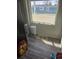 A cozy corner with a large window, suitable for a pet area or a quiet spot with natural lighting at 1489 Arapahoe St, Strasburg, CO 80136