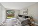 Bright living room with L-shaped sofa, large window, and modern decor at 4274 S Salida Way # 6, Aurora, CO 80013