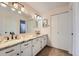 Bathroom features a double sink vanity with granite counters, providing both style and functionality at 6311 Xavier St, Arvada, CO 80003