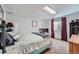 Bright bedroom with large window and neutral tones, offering a relaxing atmosphere at 6311 Xavier St, Arvada, CO 80003