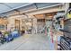 Spacious garage with overhead storage and workbench perfect for DIY projects at 6311 Xavier St, Arvada, CO 80003