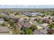 Picturesque aerial view of a residential area close to a school, featuring beautiful homes and a serene lake backdrop at 2861 Madison Ln, Broomfield, CO 80023