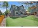 Spacious backyard with well-maintained lawn, putting green, and a patio perfect for outdoor enjoyment at 2861 Madison Ln, Broomfield, CO 80023