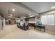 Finished basement with movie screen, comfortable seating, and recreational space at 2861 Madison Ln, Broomfield, CO 80023