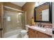 Cozy bathroom featuring a glass-enclosed shower and granite countertop with a sink at 2861 Madison Ln, Broomfield, CO 80023