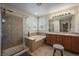 Bright bathroom with tiled shower, soaking tub, and dual sink vanity at 2861 Madison Ln, Broomfield, CO 80023