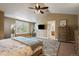 Spacious primary bedroom with large rug, vaulted ceiling, and furniture at 2861 Madison Ln, Broomfield, CO 80023