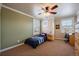 A tidy bedroom with a single bed, two windows with shutters, and carpeted flooring at 2861 Madison Ln, Broomfield, CO 80023