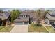 Charming home with a three-car garage, well-manicured lawn, and inviting curb appeal at 2861 Madison Ln, Broomfield, CO 80023