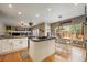 Open-concept kitchen with granite counters, stainless steel appliances, and a center island at 2861 Madison Ln, Broomfield, CO 80023