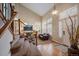 Inviting living room with high ceilings, large windows, hardwood floors, and a grand staircase at 2861 Madison Ln, Broomfield, CO 80023