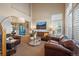 Elegant living room featuring vaulted ceilings, comfortable seating, and lots of natural light at 2861 Madison Ln, Broomfield, CO 80023