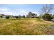 Sprawling backyard with lush green grass and a two-story home in the background at 3225 Rinn Valley Dr, Longmont, CO 80504