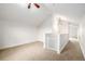 Bright bonus room featuring neutral carpet, white walls, and a classic ceiling fan for comfortable living at 3225 Rinn Valley Dr, Longmont, CO 80504