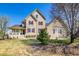 Charming two-story home with a well-maintained front yard, inviting porch, and red window shutters at 3225 Rinn Valley Dr, Longmont, CO 80504