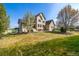 Beautifully landscaped front yard features a well maintained lawn and mature trees at 3225 Rinn Valley Dr, Longmont, CO 80504