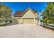 Charming two-story home featuring a spacious three-car garage, long driveway, and manicured landscaping at 3225 Rinn Valley Dr, Longmont, CO 80504