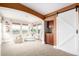 Cozy sitting room adjacent to the main bedroom featuring ample natural light and a convenient beverage bar at 3225 Rinn Valley Dr, Longmont, CO 80504