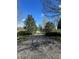 Scenic walking path with mature trees and lush landscaping at 3225 Rinn Valley Dr, Longmont, CO 80504