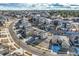 An aerial view showcases a neighborhood surrounded by lush trees and well manicured lawns at 7897 S Jamestown Ct, Aurora, CO 80016