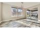 Bright dining room featuring a sliding door to the backyard and large windows at 7897 S Jamestown Ct, Aurora, CO 80016