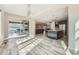 Light-filled dining room open to kitchen, featuring sliding glass doors to a backyard deck at 7897 S Jamestown Ct, Aurora, CO 80016