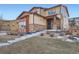 Charming two-story home with stone accents, covered porch, and well-manicured lawn at 7897 S Jamestown Ct, Aurora, CO 80016