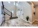 Grand foyer with soaring ceilings, a staircase, and contemporary flooring at 7897 S Jamestown Ct, Aurora, CO 80016