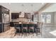 Modern kitchen with stainless steel appliances, an island with bar seating, and contemporary pendant lighting at 7897 S Jamestown Ct, Aurora, CO 80016