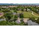 Aerial view of home featuring mature trees and green space with mountain views at 424 Arbor Dr, Lafayette, CO 80026