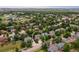 Aerial view showcasing the home nestled within a community with mature trees at 424 Arbor Dr, Lafayette, CO 80026