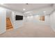 Finished basement with neutral carpeting and bright recessed lighting provides a flexible living space at 424 Arbor Dr, Lafayette, CO 80026