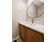 Powder room features modern sink, countertop, and wood vanity at 424 Arbor Dr, Lafayette, CO 80026