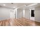 Spacious bedroom featuring hardwood floors and multiple doorways to other rooms and bathrooms at 424 Arbor Dr, Lafayette, CO 80026