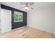 Comfortable bedroom with a ceiling fan and natural light streaming through the window at 424 Arbor Dr, Lafayette, CO 80026