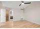 Bright bedroom with hardwood floors, ceiling fan and ensuite bathroom provides style and comfort at 424 Arbor Dr, Lafayette, CO 80026
