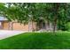 Inviting view of a home's exterior featuring a well-maintained lawn and three-car attached garage at 424 Arbor Dr, Lafayette, CO 80026