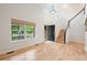Bright foyer with hardwood floors, high ceilings, staircase, and large window offering natural light at 424 Arbor Dr, Lafayette, CO 80026