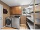 Well-organized laundry room with stainless steel appliances and shelving at 424 Arbor Dr, Lafayette, CO 80026
