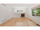 Spacious living room features hardwood floors, fireplace, and large picture window at 424 Arbor Dr, Lafayette, CO 80026