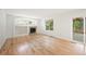 Bright living room with fireplace, hardwood floors, and access to outdoor deck at 424 Arbor Dr, Lafayette, CO 80026