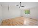 Main bedroom with vaulted ceiling, large window, and hardwood floors at 424 Arbor Dr, Lafayette, CO 80026
