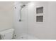 Sleek, glass-enclosed shower showcases modern fixtures and unique tile work at 424 Arbor Dr, Lafayette, CO 80026